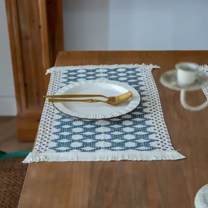 Farmhouse woven cotton linen placemat with blue geometric patterns and fringe tassels