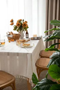 Vintage white hollowed cotton linen tablecloth with elegant floral embroidery and tassels