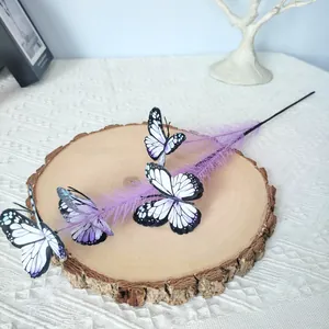 Detail view of purple artificial flower branch with realistic butterfly accents