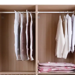 Space-saving hanging vacuum storage bags for clothes and quilts in closet.