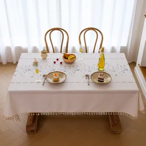 Elegant embroidered tablecloth with floral patterns and tassel edges for home decor