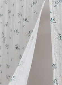Close-up of minimalist floral cotton door curtain showing delicate fabric texture
