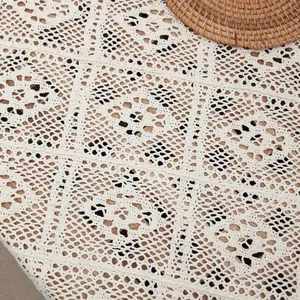 Macro view of detailed vintage hollow white crochet lace pattern for table runner