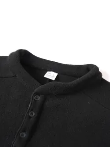 Detail view of the stand collar and soft fleece texture of the black mens sweatshirt