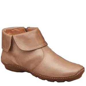 Detail view of women's leather ankle boots with side zipper and fold-over cuff design