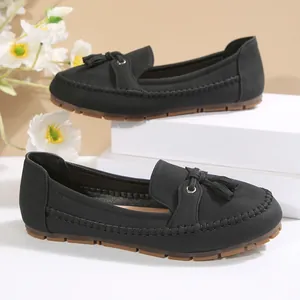 Classic black loafers for women with elegant tassel details and durable soft soles.