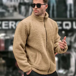 Detail view of men's fuzzy fleece jacket with stand collar and zipper in khaki