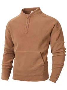 Close-up of a men's brown fleece henley sweatshirt with a stand collar and kangaroo pocket.