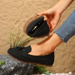 Black flexible women's loafers featuring tassels and a highly soft anti-slip rubber sole