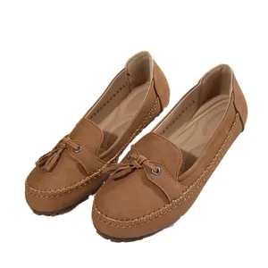Classic tan women's loafers with tassel detail and soft comfortable driving sole