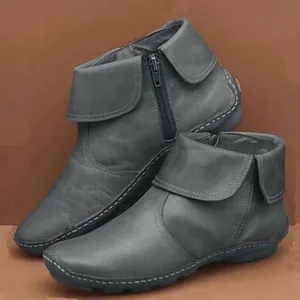 Women's grey leather ankle boots with round toe, side zipper, and fold-over cuff details