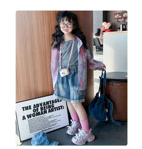 Silver rhinestone children's chunky sneakers shown in a trendy urban street style setting