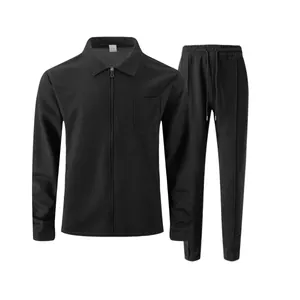 Men's solid black waffle knit tracksuit set with zipper jacket and matching pants