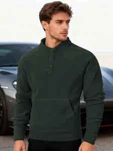 Detailed macro view of dark green men's fleece sweatshirt with buttoned stand collar