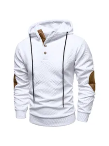 Close-up detail of white textured men's hoodie with brown elbow patches and button placket
