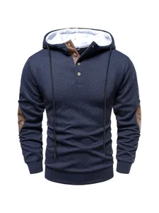 Detailed view of navy blue men's textured heavyweight hoodie featuring a button placket