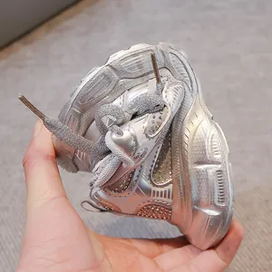 Detailed view showing high flexibility and rhinestone finish of silver kids sneakers