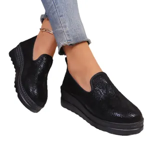 Stylish black thick-sole slip-on loafers for women with textured round-toe design