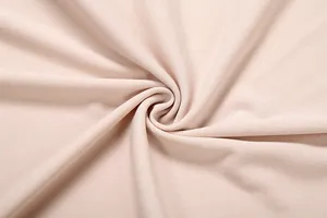 Gros plan détaillé de la texture d'un tissu en maille beige doux haut de gamme pour femme