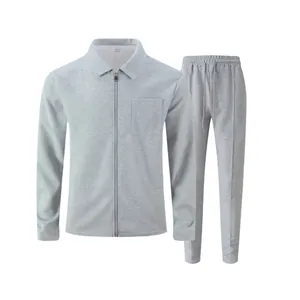 Close-up of men's grey waffle-knit two-piece set featuring zippered jacket and pants