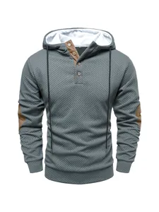 Front view of men's heavy textured grey hoodie with button neck detail and patches