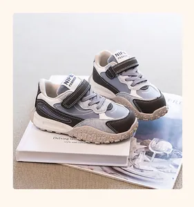 Blue and grey children's dad shoes with durable textured sole and velcro strap