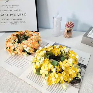 Set of yellow and orange artificial wildflower wreaths for table and candle decoration