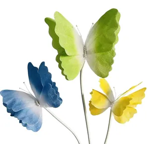 Detailed macro view of colorful gradient felt butterflies with mesh wings and pearl accents
