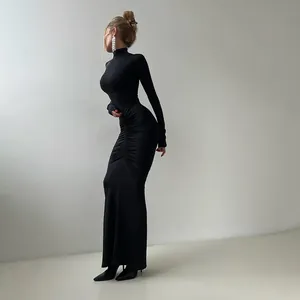 Side profile view of elegant black high-neck maxi dress featuring ruched waist detail