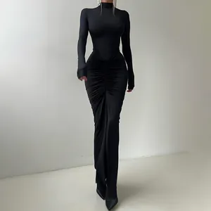 Full-length view of an elegant black ruched high-neck maxi dress for autumn