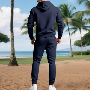 Back view of navy blue heavy fleece hoodie and jogger set in a tropical beach setting