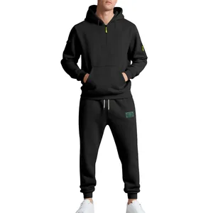 Front view of black heavy fleece men's tracksuit featuring a half-zip hoodie and joggers