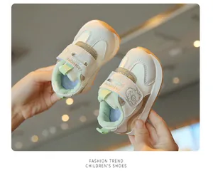 Close-up of baby sneakers with Velcro straps and cute animal detail