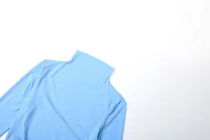 Close-up of elegant light blue high neck and shoulder detail of slim fit dress