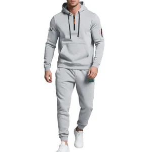 Full view of men's grey heavy fleece tracksuit with utility sleeve pockets and hood detail