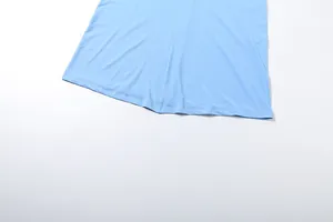 Detail view showcasing the high-quality hem stitching on a light blue long sleeve dress