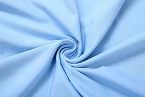 Macro detail of soft light blue pleated fabric for women's elegant slim-fit dress