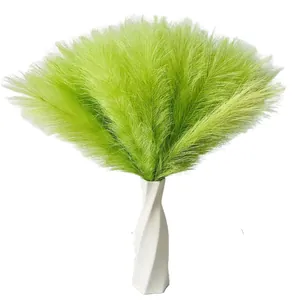 Artificial green pampas grass bouquet in a white spiral vase for home decor