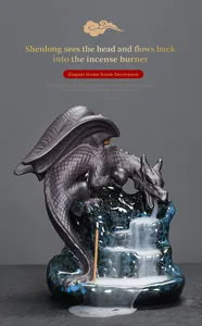 Detail of ceramic winged dragon backflow incense burner with cascading smoke effect