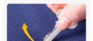 Close-up view of the durable scratch-resistant woven fabric on a large moving storage bag