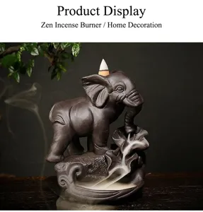 Detailed close-up of a purple clay elephant backflow incense burner with flowing smoke