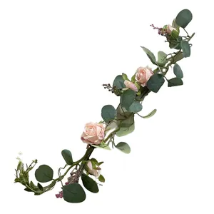 Detailed view of artificial pink rose and eucalyptus garland for home decoration