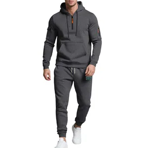 Detail view of charcoal grey heavyweight fleece tracksuit with orange zipper pull