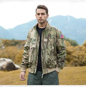 Detailed view of multicam tactical flight jacket with American flag patch on sleeve.