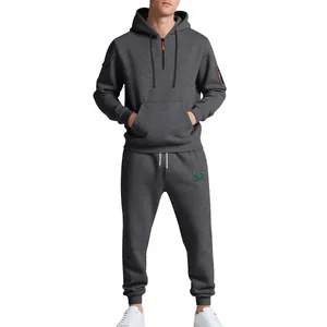 Close-up full-body view showing fit and texture of men's grey heavy fleece hoodie set