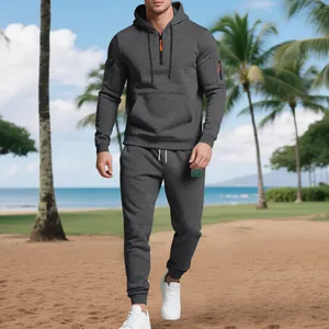 Detailed view of the textured grey fleece hoodie and jogger set in an outdoor setting