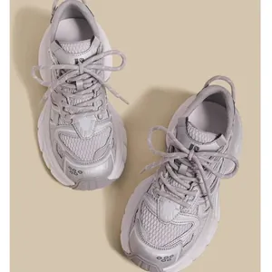 Fashionable grey breathable mesh kids sneakers in a trendy chunky daddy shoe style