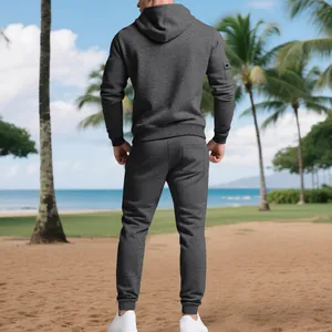 Detailed back view of a heavyweight grey fleece-lined men's tracksuit at the beach