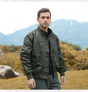 Detail view of men's olive green tactical bomber jacket with military flight patches
