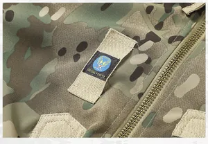 Close-up detail of camouflage tactical flight jacket with Special Forces patch and zipper